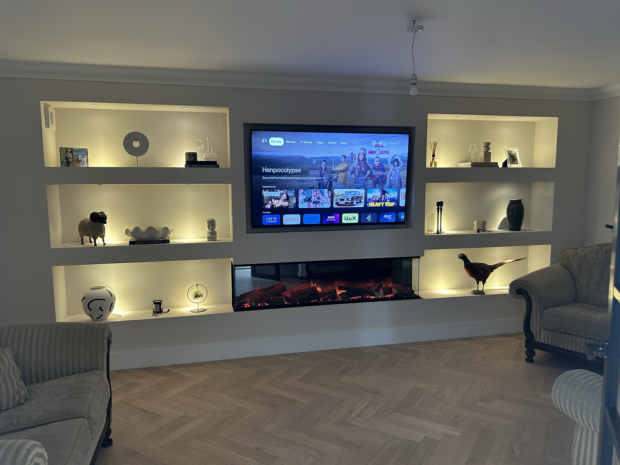 Bespoke media wall with linear fireplace and integrated storage